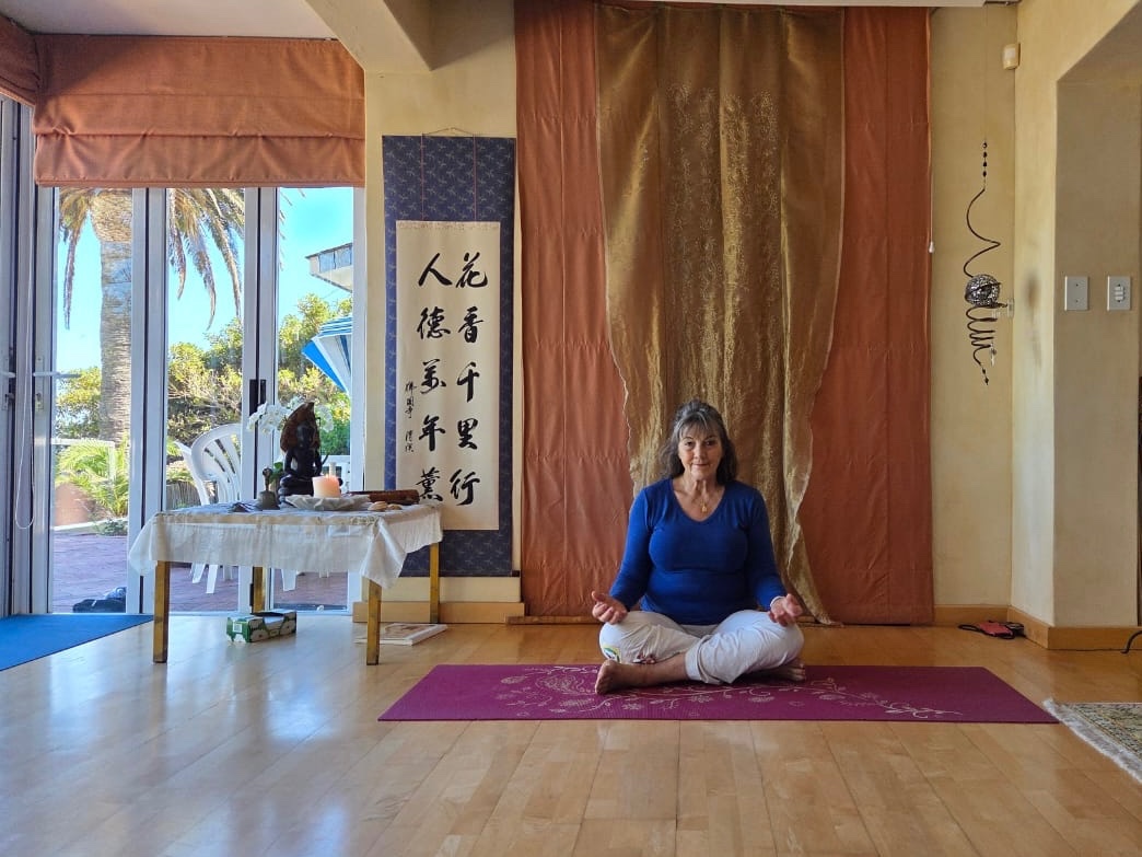 The teacher in her yoga studio